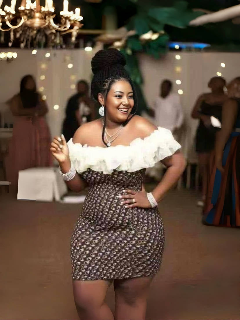 Off-shoulder ruffle dress with white shoulder frills and dark patterned body