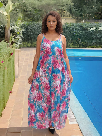 Vibrant printed sleeveless maxi dress in blue, pink, and white floral pattern