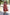 : Traditional Ethnic Sleeveless Tiered Dress with Geometric Patterns and Circular Motifs