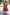 : Traditional Ethnic Sleeveless Tiered Dress with Geometric Patterns and Circular Motifs