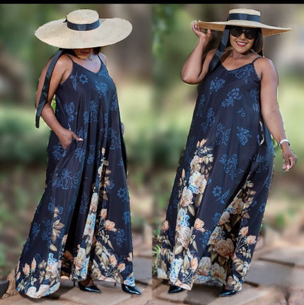 Navy sleeveless botanical maxi dress with flared hem and wide floral skirt