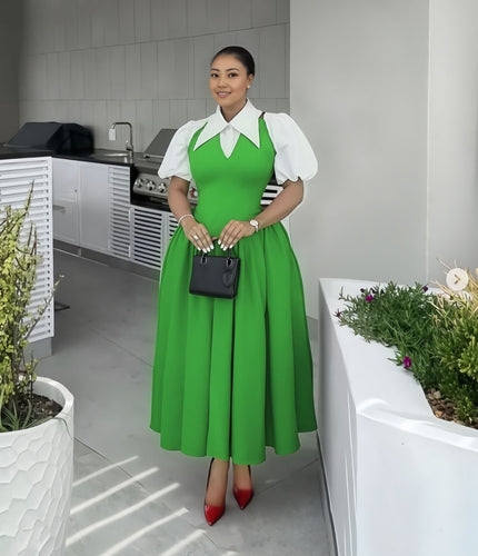 Lime-green pleated midi dress with puff sleeves, white collar, and fitted waist