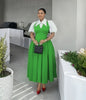 Lime-green pleated midi dress with puff sleeves, white collar, and fitted waist
