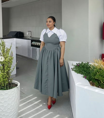Gray pleated midi dress with puff sleeves, white collar, and cinched waist