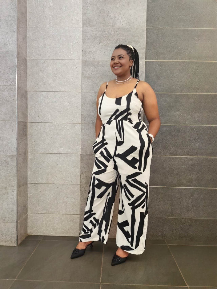 Sleeveless wide-leg jumpsuit, white with bold black abstract pattern