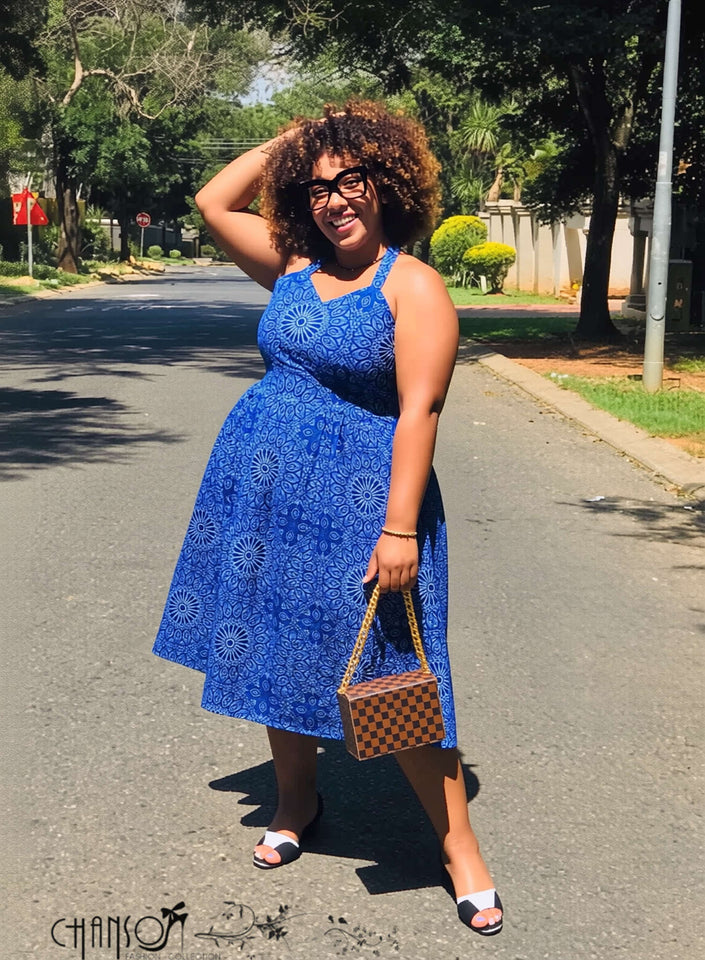 Blue halter midi fit-and-flare dress with geometric floral print, sleeveless.