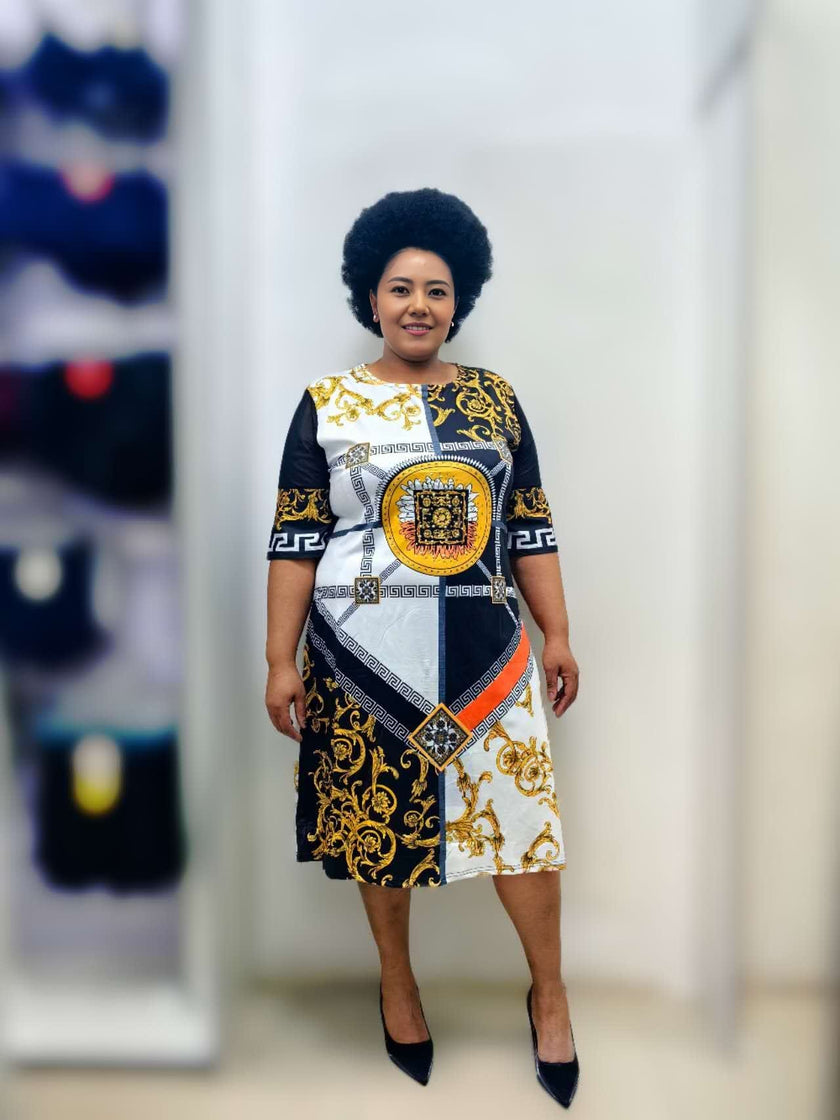 Plus size printed midi dress with stretch waist, black with gold and blue graphic print
