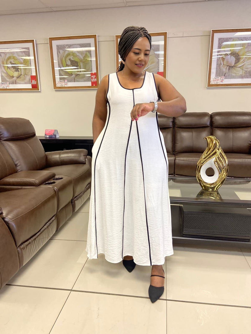 Sleeveless A-line maxi dress, white with black-trim neckline and pockets