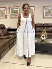 White sleeveless A-line maxi dress with black-trim vertical seam detail and pockets