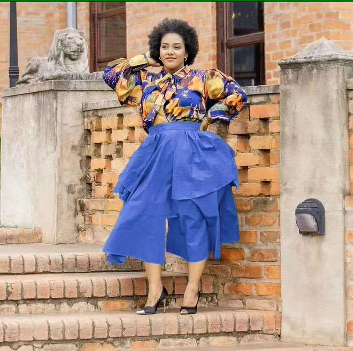 Floral puff-sleeve blouse with blue tiered midi skirt