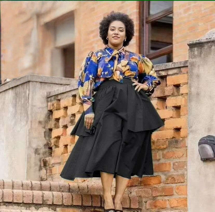 Floral puff-sleeve blouse with black tiered midi skirt