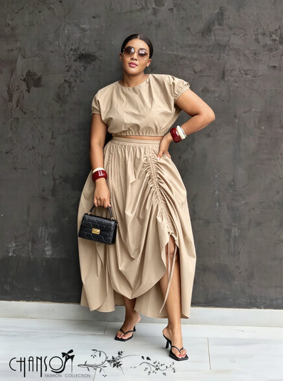 Nude ruched maxi skirt with adjustable waist, draped folds and side slit