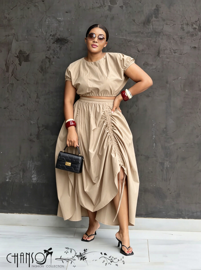 Nude ruched maxi skirt with adjustable waist, draped folds and side slit