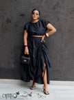 Black ruched maxi skirt with gathered waist and draped side-slit hem
