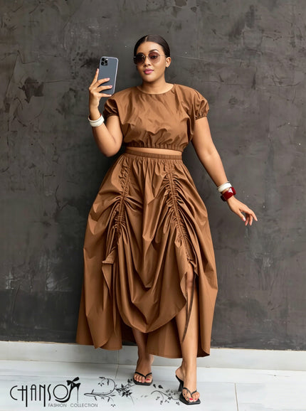 Brown ruched maxi skirt with gathered waist and draped side-slit hem