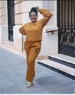Tan two-piece jogger set with crew sweatshirt and tapered pants, small chest emblem