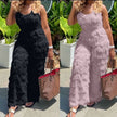 Black and light-pink textured belted jumpsuit with fringe detail, sleeveless