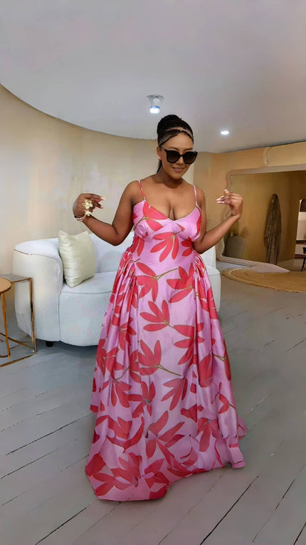 Sleeveless maxi dress with red leaf print and flared skirt