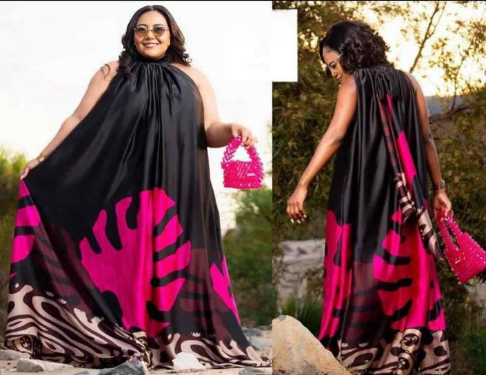 Black halter maxi dress with bold pink and purple abstract floral print, sleeveless