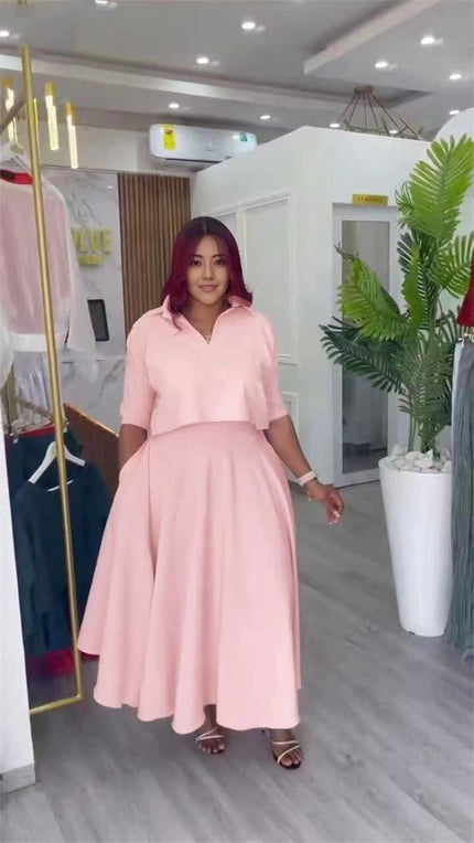 Pink collared short-sleeve shirt and A-line skirt set with matching waist seam