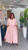 Pink collared short-sleeve shirt and A-line skirt set with matching waist seam