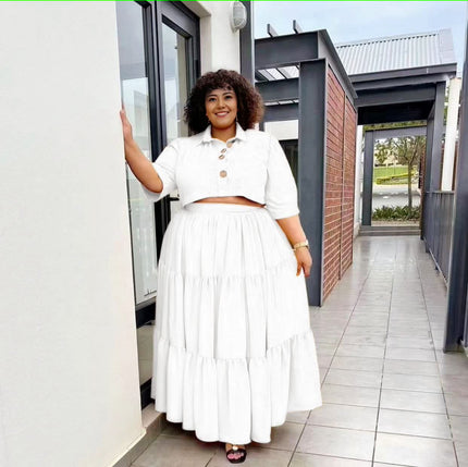 White tiered maxi skirt with stretch waist and layered ruffle tiers