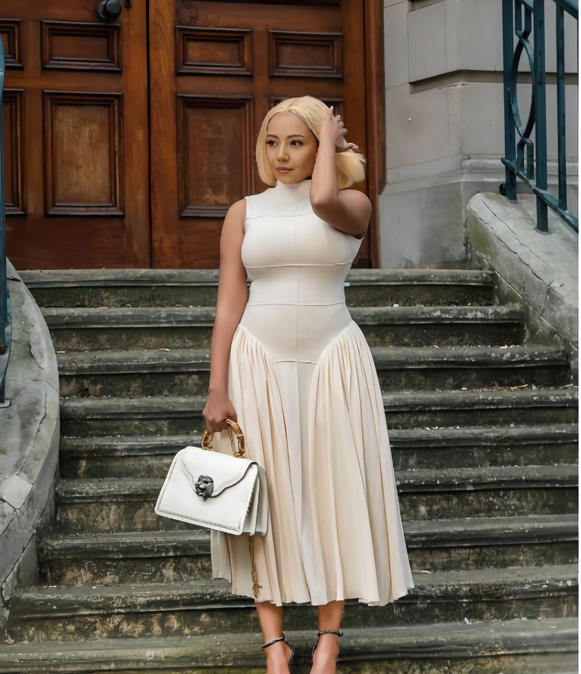 Beige A-line midi dress with defined waist, sleeveless high neckline, pleated skirt