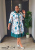 Plus size shirt dress in white with teal circle geometric print, collared midi
