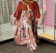 Rust maxi dress with lace-trim empire waist, puff sleeves, and patterned skirt