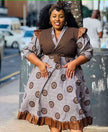 Brown and gray circle print midi dress with V-neck, tie waist, and puff sleeves