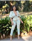 Light blue printed jumpsuit with puff sleeves and V-neck, wide-leg fit