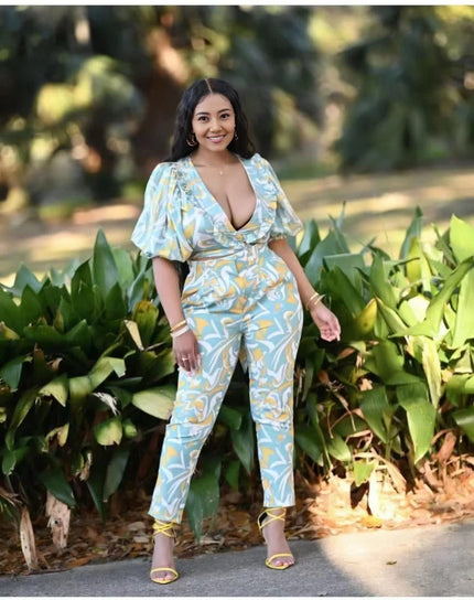 Printed light-blue jumpsuit with puff sleeves and V-neck