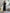 Button-Front Ribbed Knit Midi Dress with Long Sleeves and Pleated Hem Design