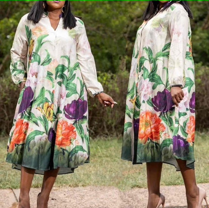 Floral V-neck A-line midi dress with puff sleeves, white base and green pink orange print
