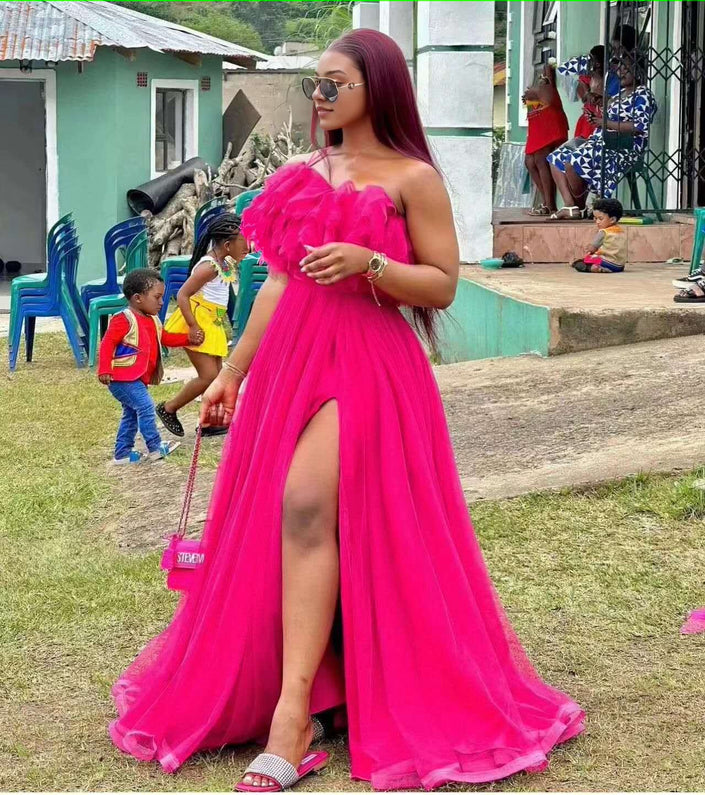 High-slit evening maxi dress in deep pink with ruffled bodice