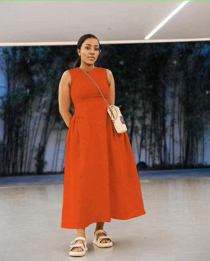 Orange-red sleeveless maxi dress with pleated waist, round neckline and A-line hem