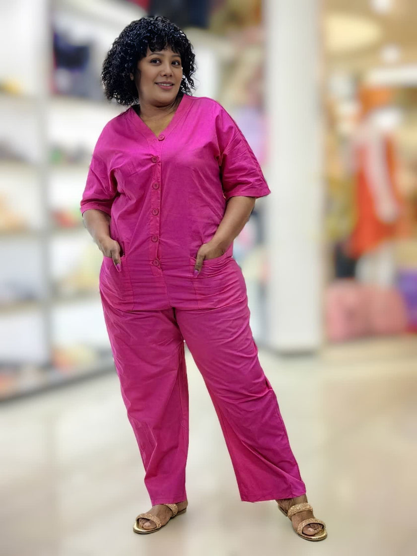 Deep-pink V-neck button-front loose jumpsuit with short sleeves and side pockets