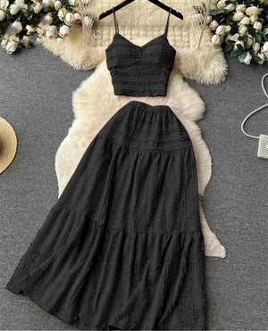 Pleated maxi skirt set in black with smocked cami top and tiered maxi skirt