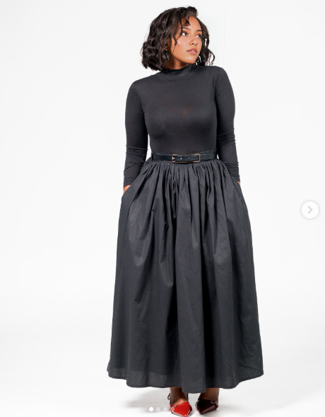 High-waist dark A-line maxi skirt with gathered pleats and belt loops