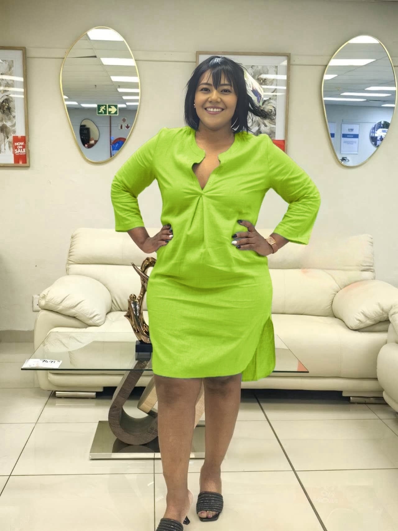 Green long-sleeve shirt dress with V-neck and button front, above-knee length
