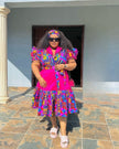 Pink and multicolor printed midi dress with puff sleeves and tiered skirt