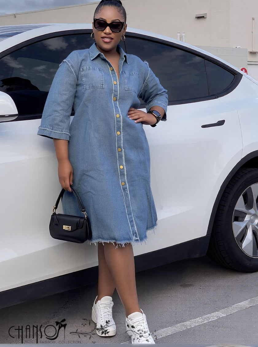 Oversized denim shirt dress with button front, three-quarter sleeves, frayed hem