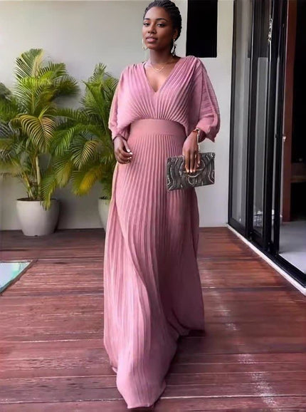 Pink pleated maxi dress with V-neck and batwing sleeves, long gathered skirt