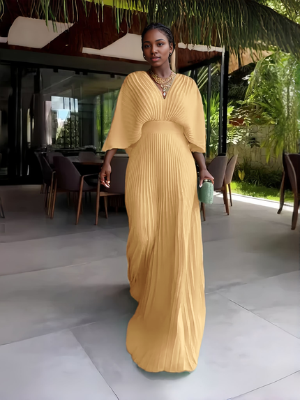 Beige pleated maxi dress with V-neck and batwing sleeves, long flowing skirt