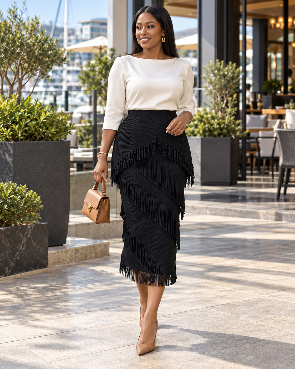 Black layered midi skirt with diagonal fringe panels and a fringed hem