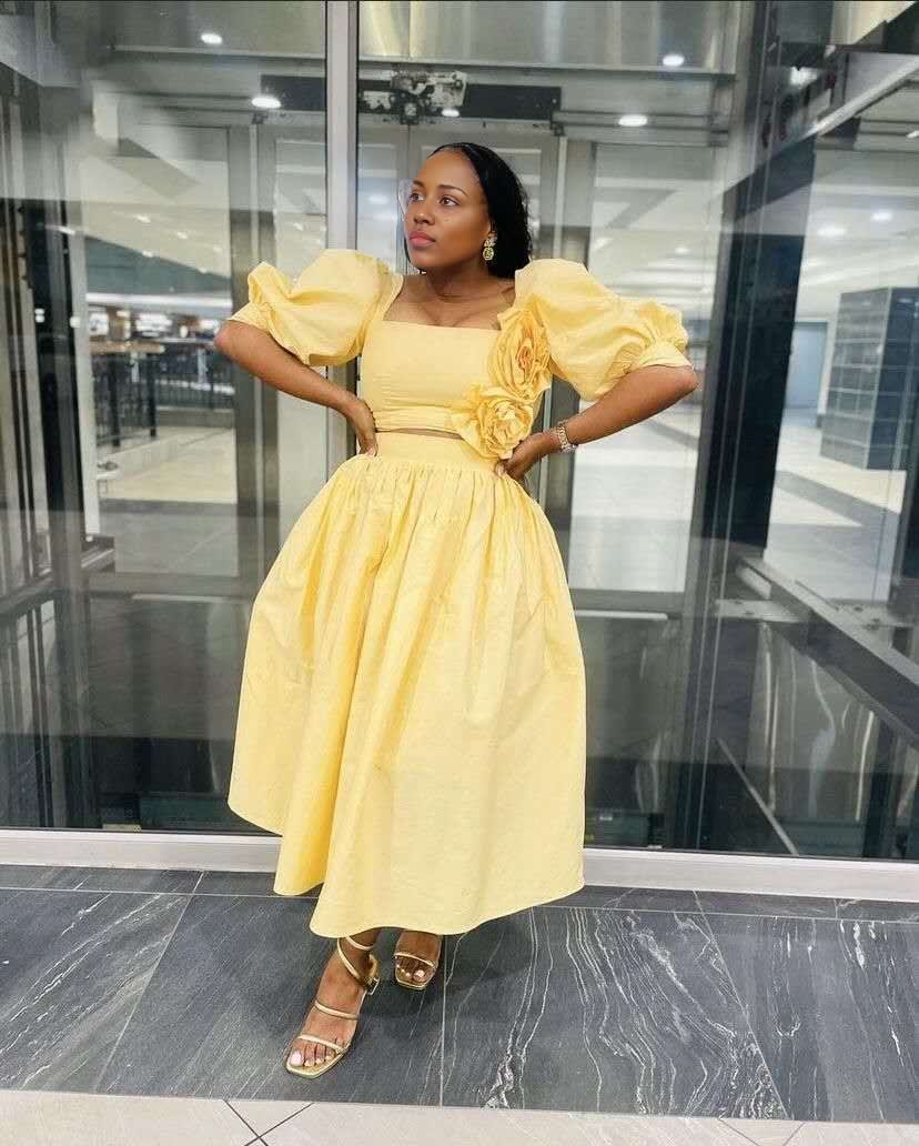 Yellow midi dress with puff sleeves and floral waist detail, square neckline