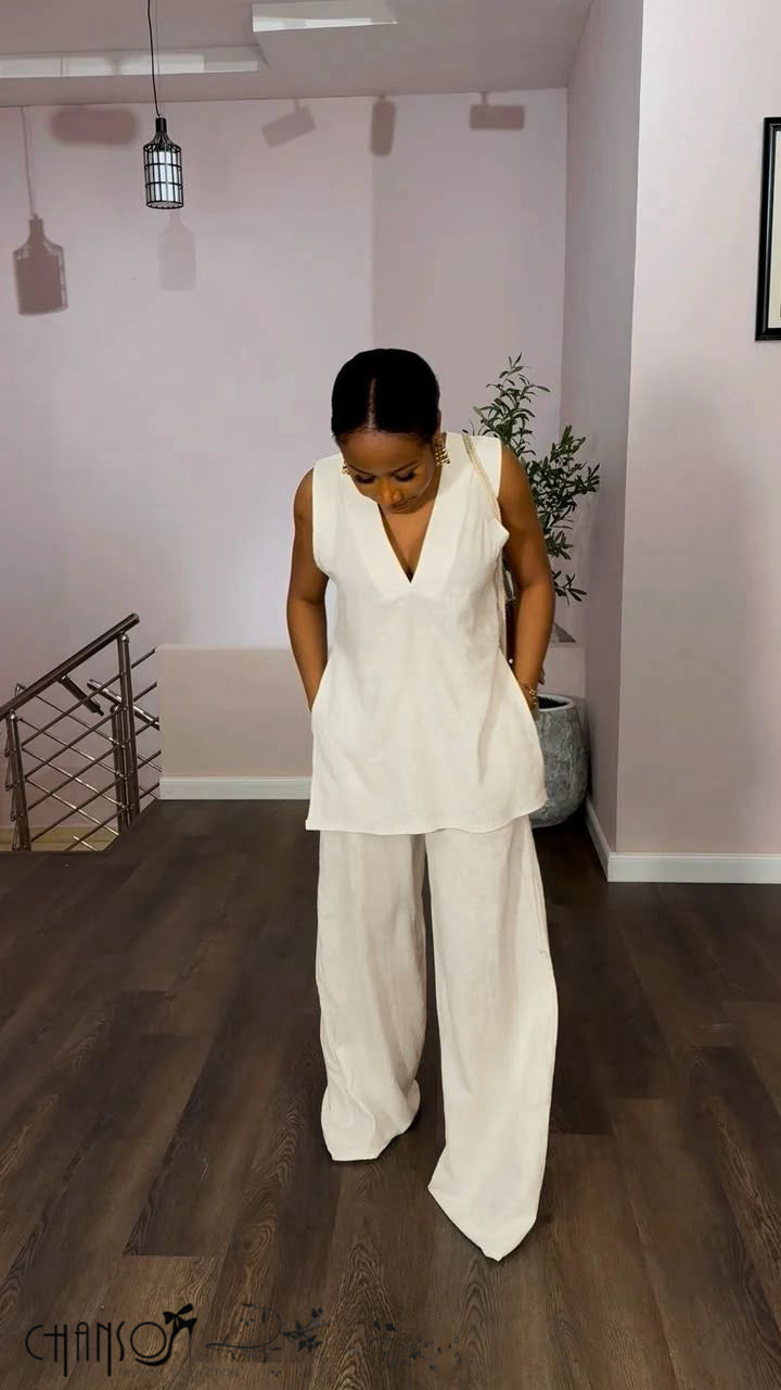 Women's cream sleeveless V neck tunic and wide leg pants set with side pockets