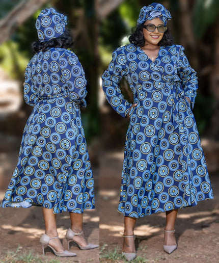 Blue wrap dress with circular pattern, long puff sleeves, V-neck and tie waist