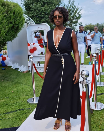 Black sleeveless V-neck midi dress with button accents and waist belt