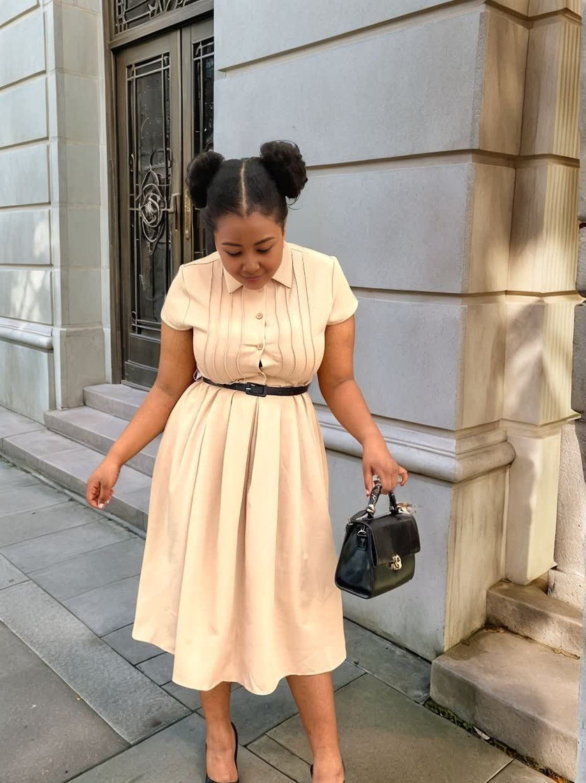 Cream midi dress with short sleeves, collared neckline, belted waist tie, full skirt